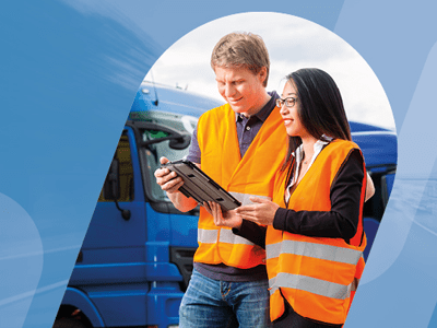 Two people wearing hi viz jackets