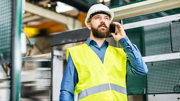 Man talking on phone in warehouse