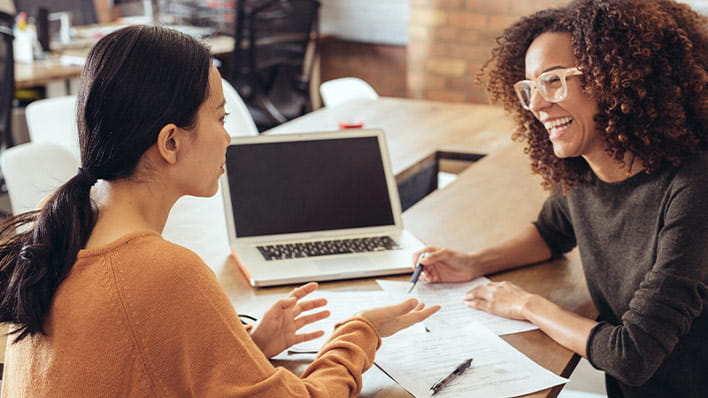 Two people in a meeting