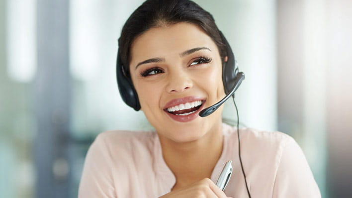 Woman wearing headset smiling