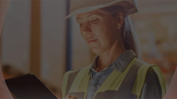 Woman wearing hard hat and high viz