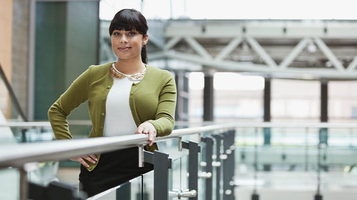 Person standing by railing.